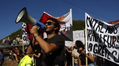 Nationwide Strikes Erupt Opposing Fiscal Cuts